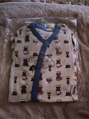 Avon Tiny Tillia White Baby Coverall with Blue Trim and Multicolor Animal Prints